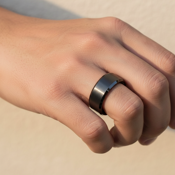 Black tungsten ring on man's hand